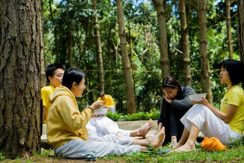 group-sitting-under-trees-eating-opt
